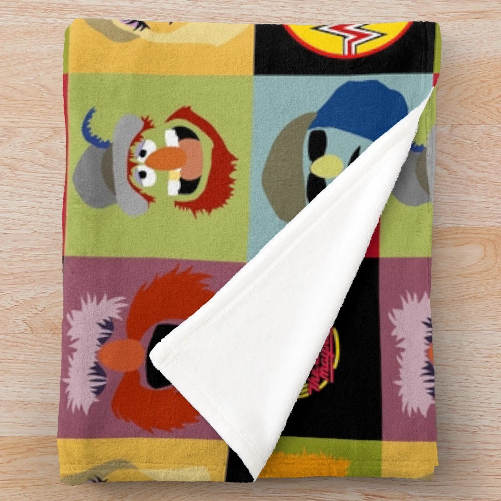 Muppets plush blanket with characters from the Electric Mayhem band