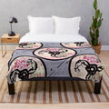 A plush blanket featuring a muscular design for music and fitness enthusiasts