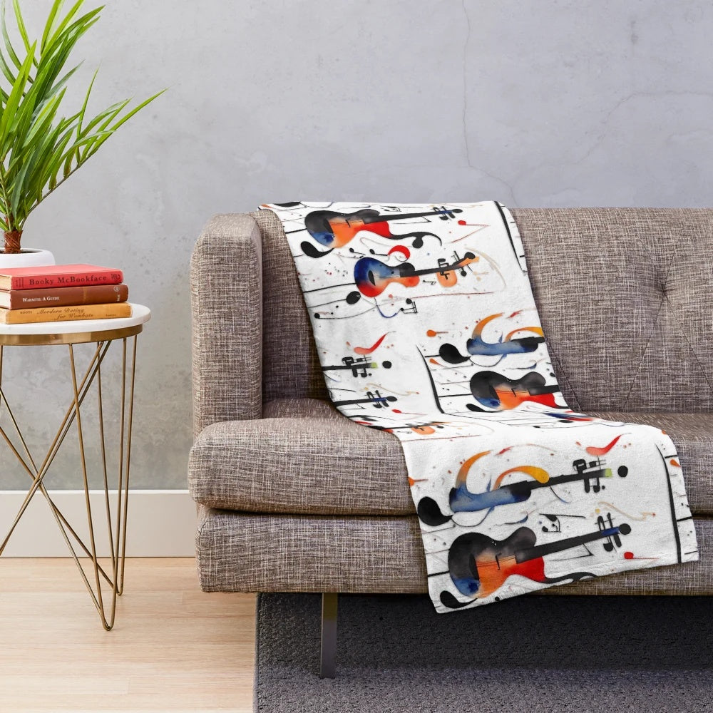 Plush blanket featuring a music-inspired graphic design with guitars