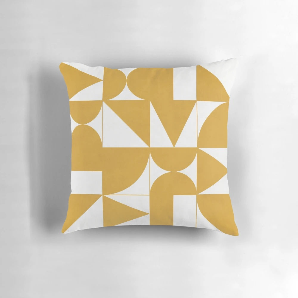 Mustard yellow throw pillow with geometric patterns, perfect for modern and minimalist home decor.