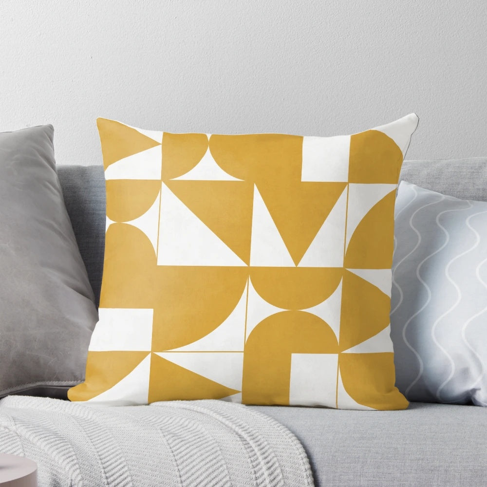 Mustard yellow throw pillow with geometric patterns, perfect for modern and minimalist home decor.