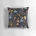 A pillow featuring a pattern of dark, wild forest mushrooms