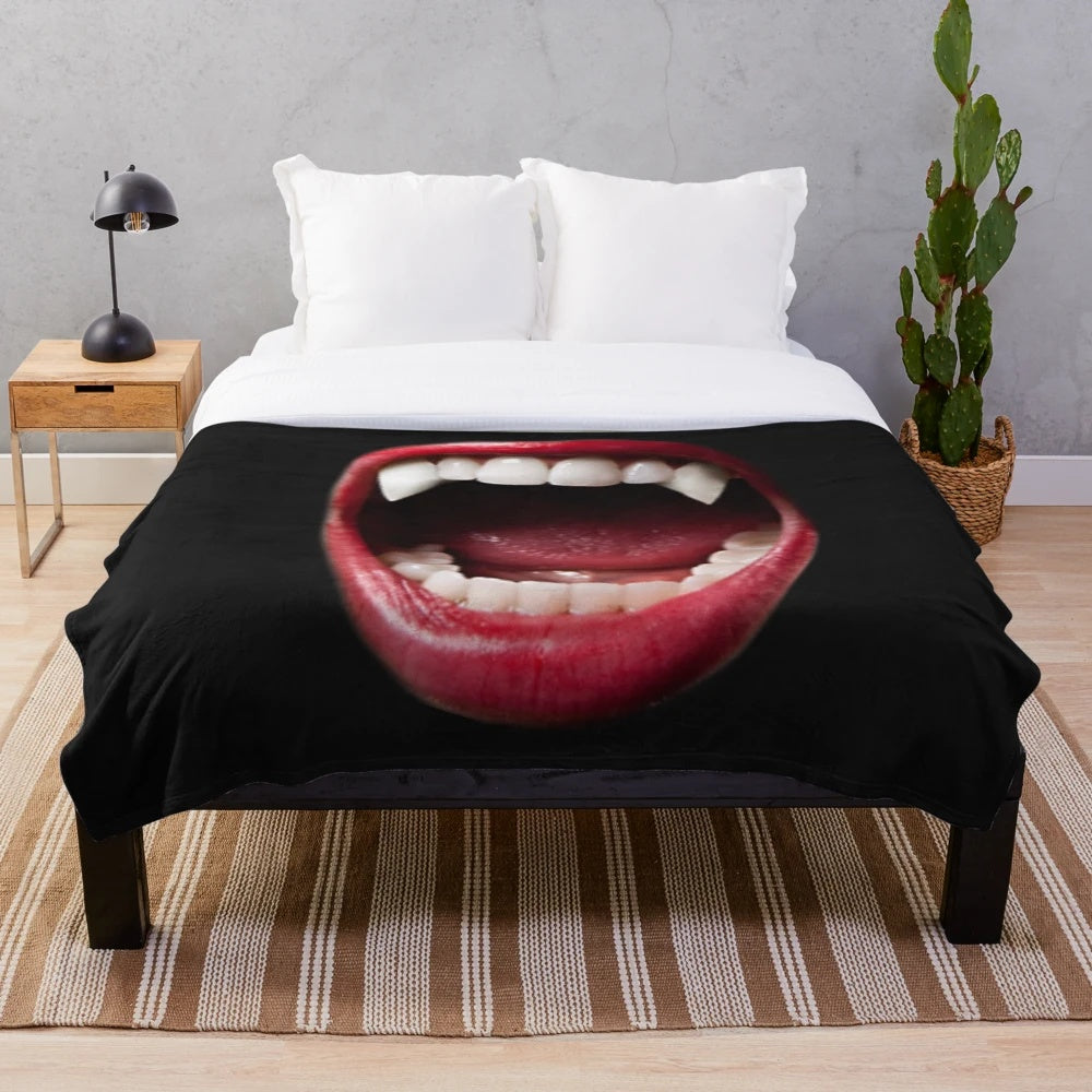 Vampire-themed plush blanket with dark and eerie patterns