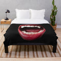 Vampire-themed plush blanket with dark and eerie patterns