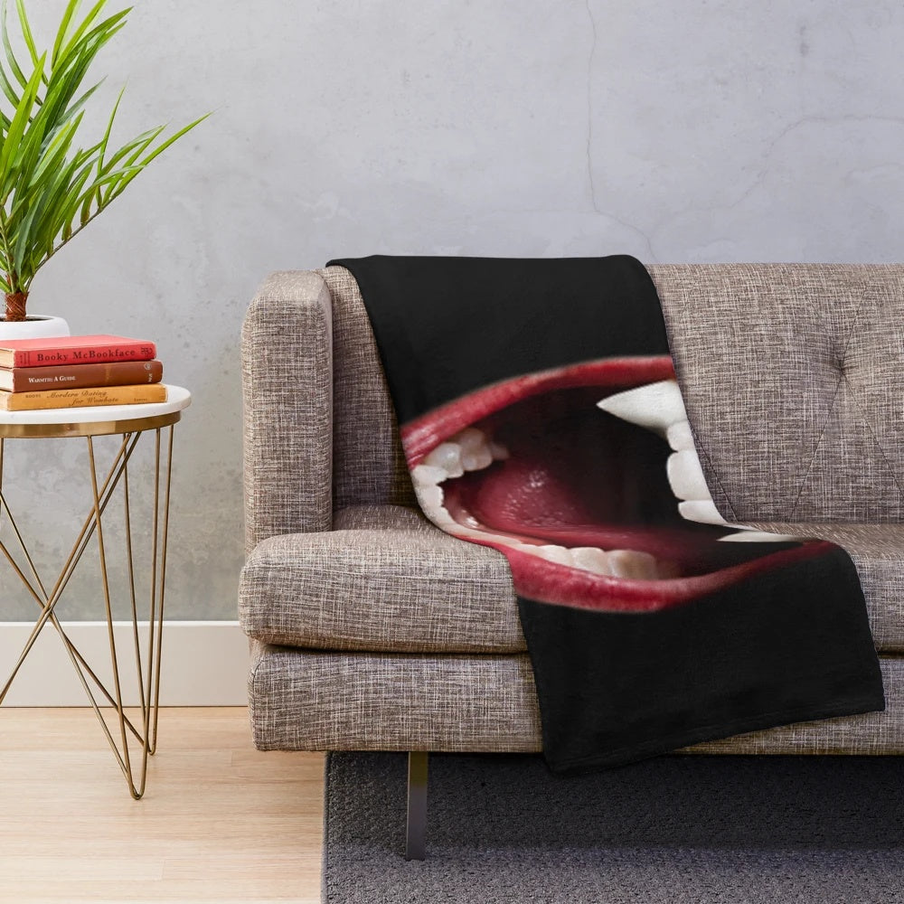 Vampire-themed plush blanket with dark and eerie patterns