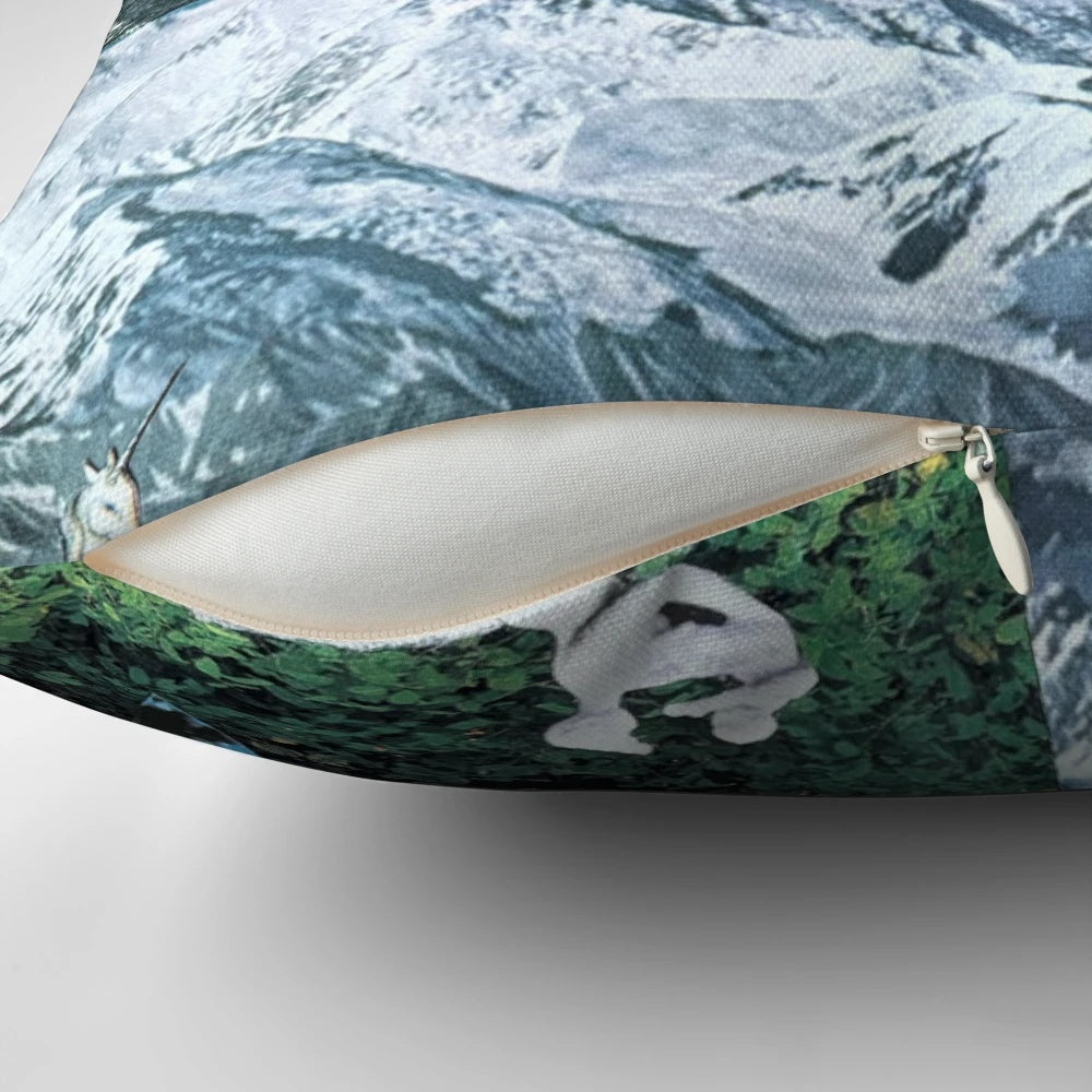 Decorative pillow featuring a collage of misty Pacific Northwest nature scenes including mountains, a tower, birds, and a statue or unicorn-like figure.