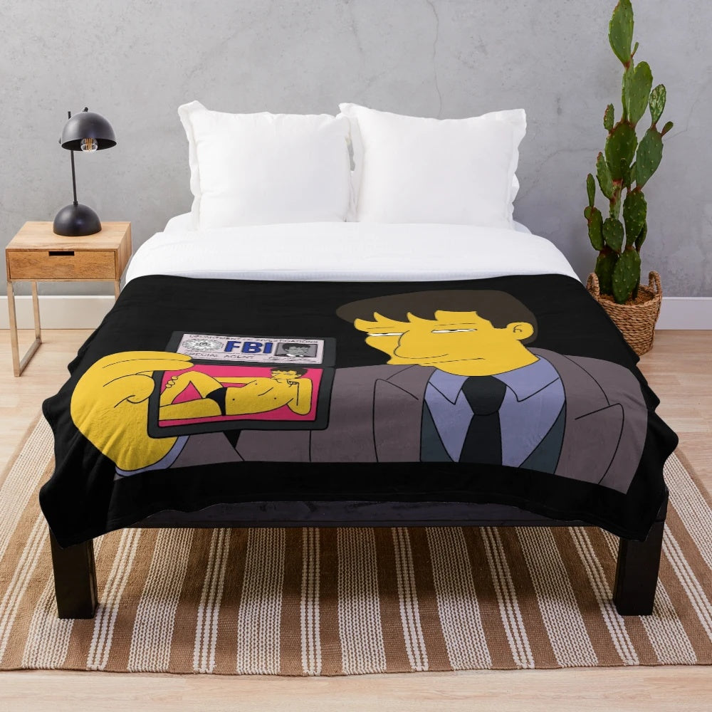 Plush blanket featuring an X-Files inspired design with Fox Mulder