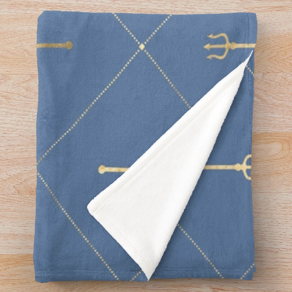 Plush blanket featuring a geometric, Poseidon-inspired design in shades of blue and gold