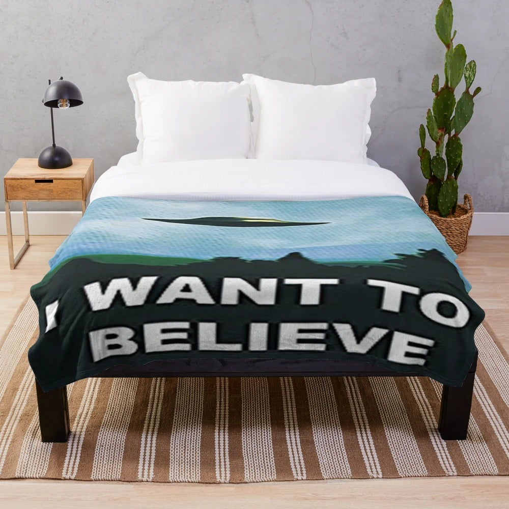 X-Files inspired plush blanket with UFO and alien graphic