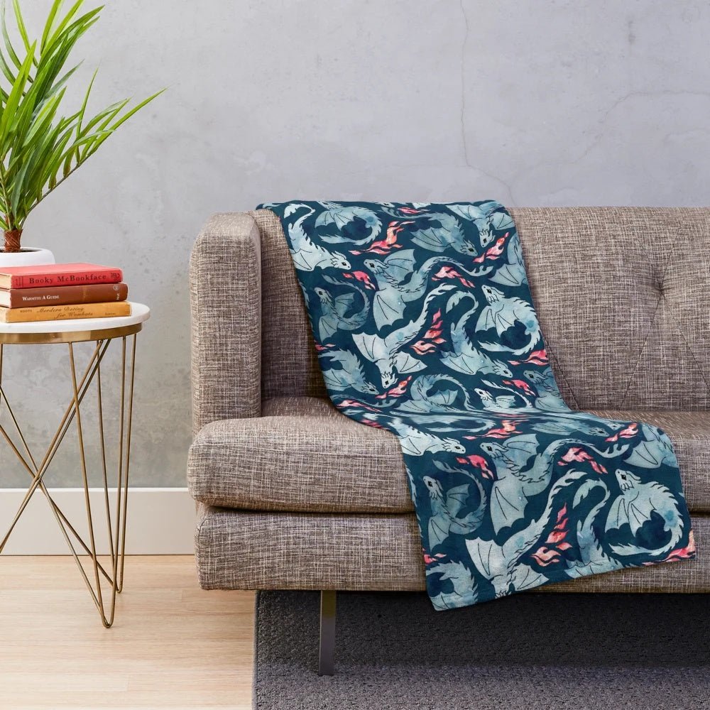 Navy blue plush blanket with a dragon fire design