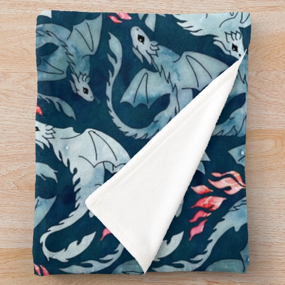 Navy blue plush blanket with a dragon fire design
