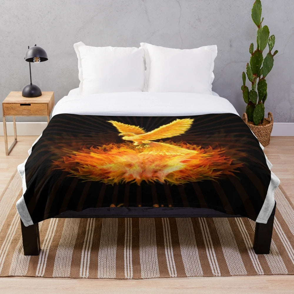Plush blanket featuring a phoenix rising from flames, a mythological bird of hope and rebirth