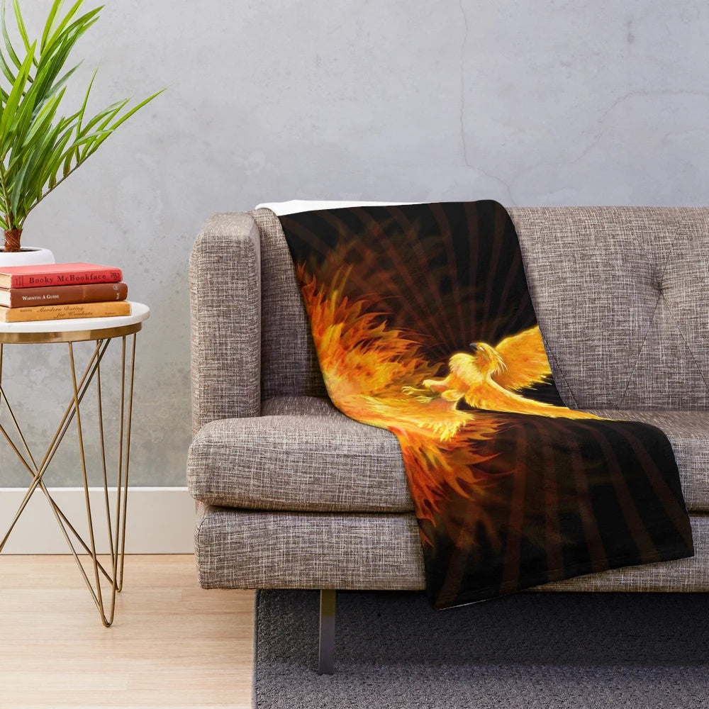 Plush blanket featuring a phoenix rising from flames, a mythological bird of hope and rebirth