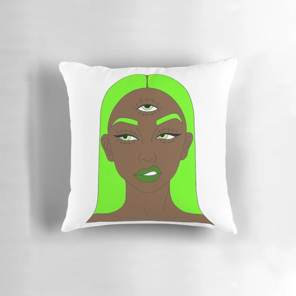 A green and colorful pillow design featuring a woman with a third eye symbol, representing spiritual awakening and consciousness.
