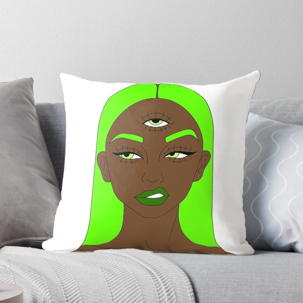 A green and colorful pillow design featuring a woman with a third eye symbol, representing spiritual awakening and consciousness.