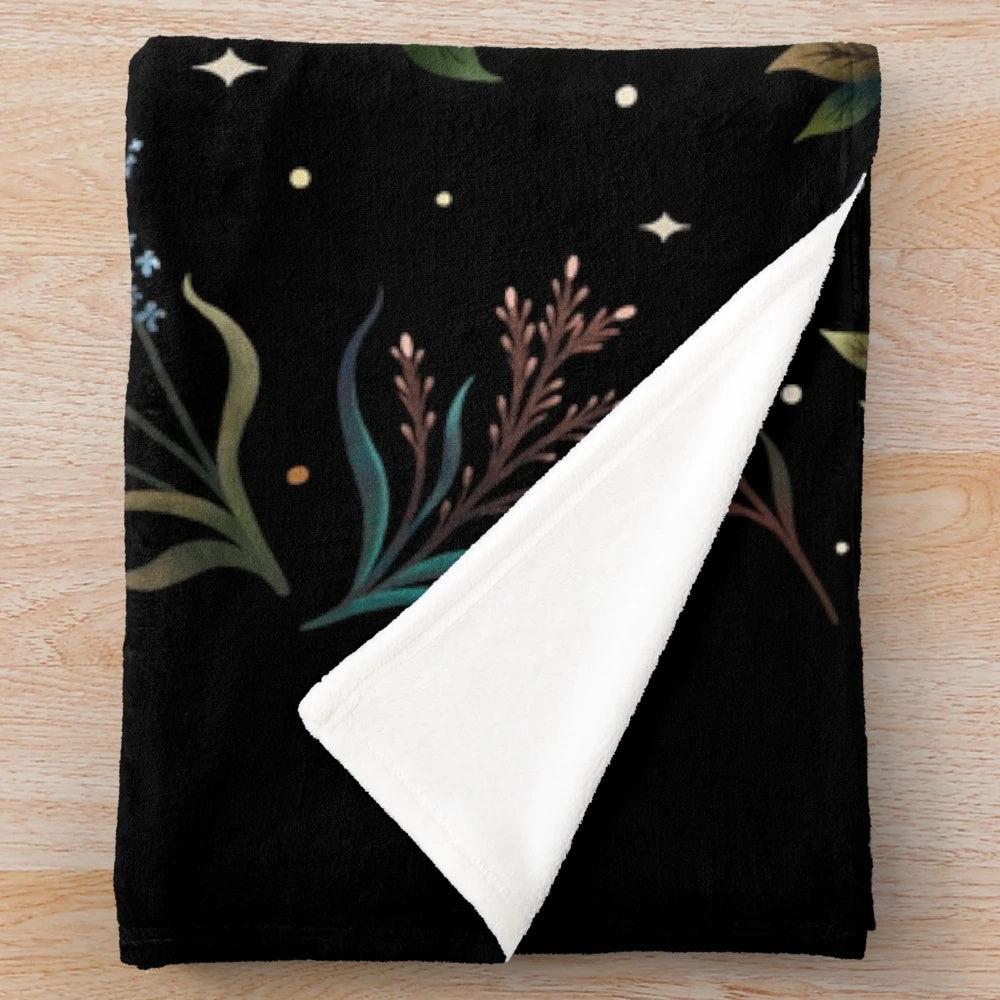 Crescent moon plush blanket with botanical floral design