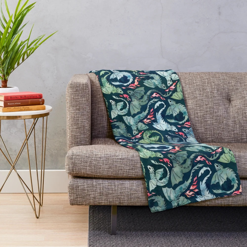 Dark blue and green plush blanket with a fantasy fire-breathing dragon design
