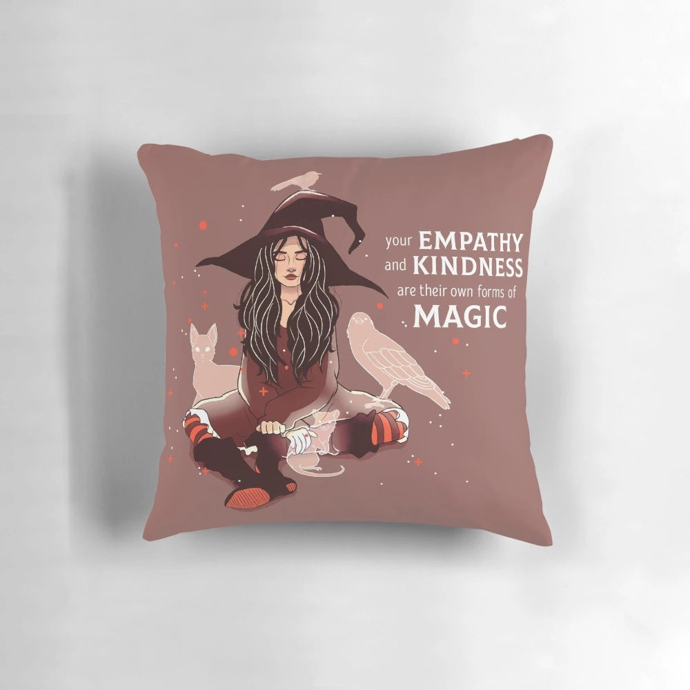 Decorative witch-themed pillow with the text "Your Empathy and Kindness Are Their Own Forms of Magic