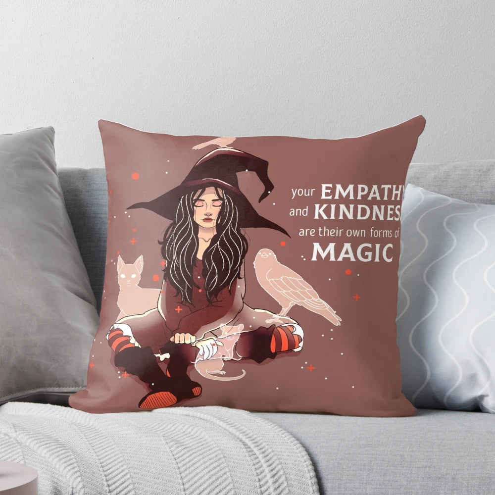 Decorative witch-themed pillow with the text "Your Empathy and Kindness Are Their Own Forms of Magic
