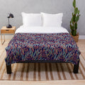 Mystical eucalyptus-inspired plush blanket with a blue and green botanical pattern