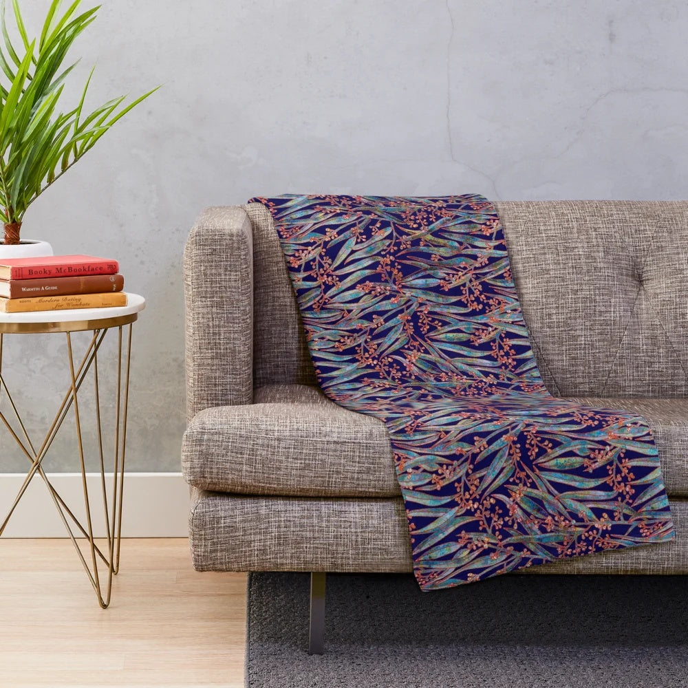 Mystical eucalyptus-inspired plush blanket with a blue and green botanical pattern