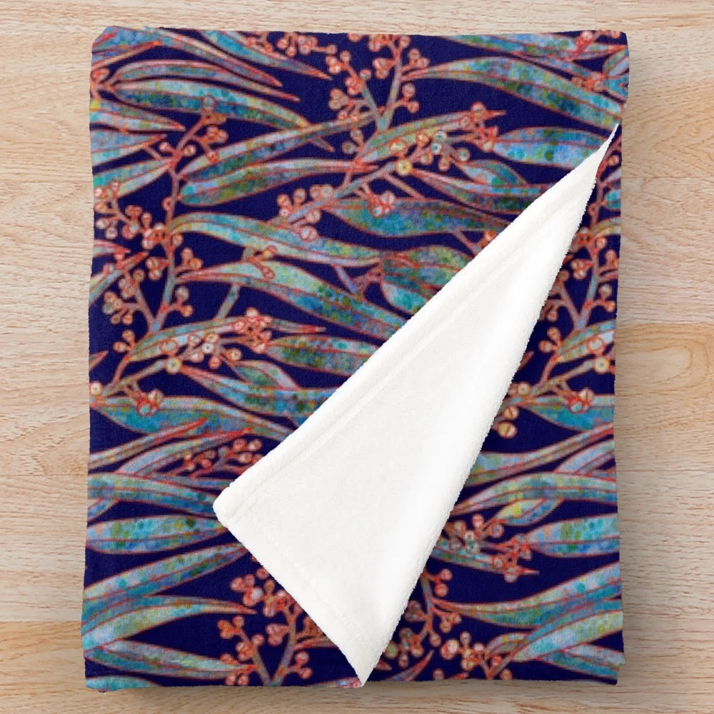 Mystical eucalyptus-inspired plush blanket with a blue and green botanical pattern