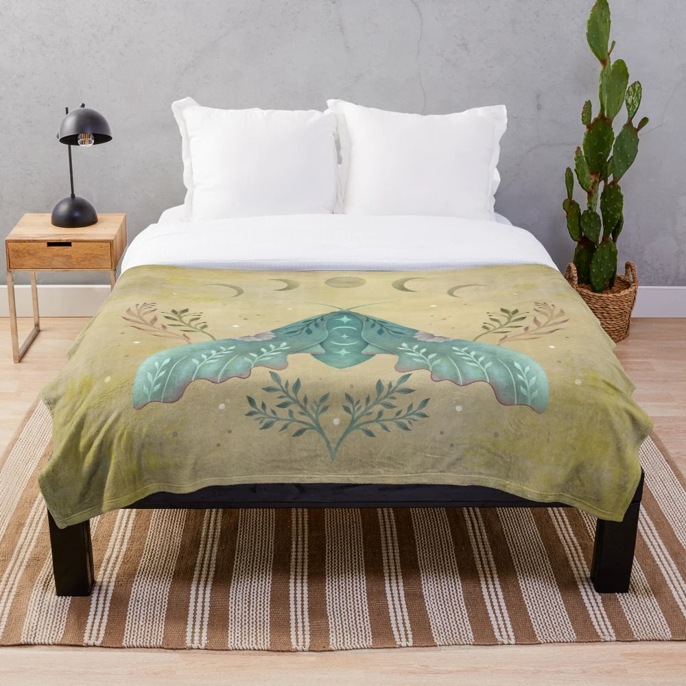 Vintage oriental plush blanket featuring a luna moth design