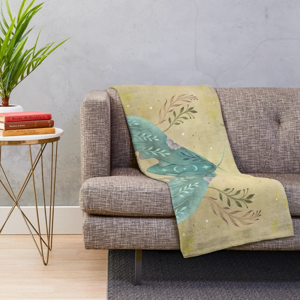 Vintage oriental plush blanket featuring a luna moth design
