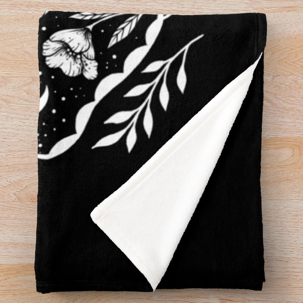 Plush blanket with a mystical moon and moth design for bohemian-style home decor