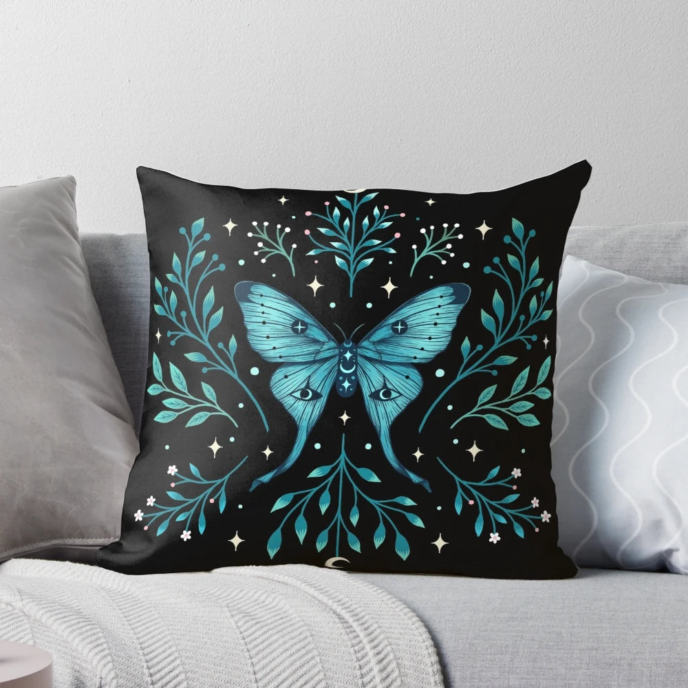 Turquoise pillow with a mystical luna moth design, featuring botanical elements for a boho, witchy vibe.