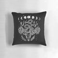 A decorative throw pillow featuring a moon phases, snakes, and crystals witchy design.