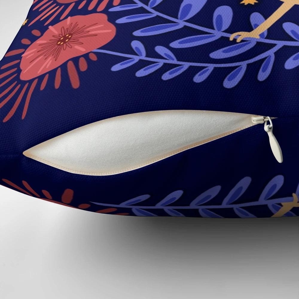 A decorative pillow featuring a mystical owl surrounded by flowers, stars, and a crescent moon against a dark background.