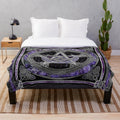 Purple plush blanket featuring sacred symbols like pentagram, triskelion, and triple moon