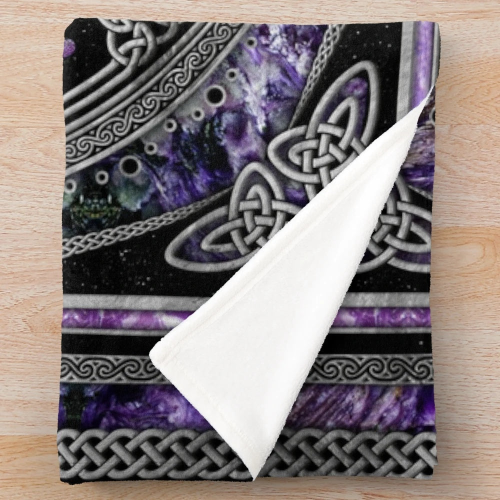 Purple plush blanket featuring sacred symbols like pentagram, triskelion, and triple moon