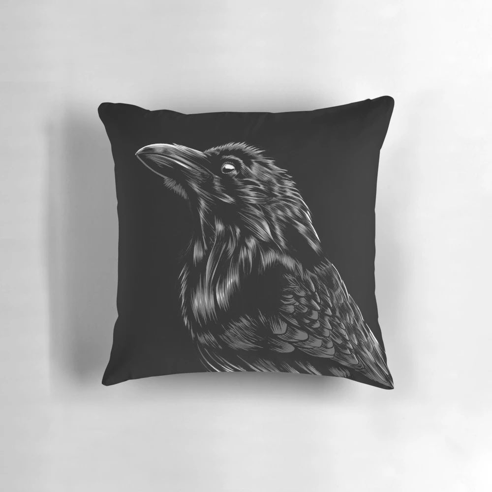 A black and white raven pillow with intricate feather details, perfect for gothic and spiritual decor.