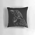 A black and white raven pillow with intricate feather details, perfect for gothic and spiritual decor.