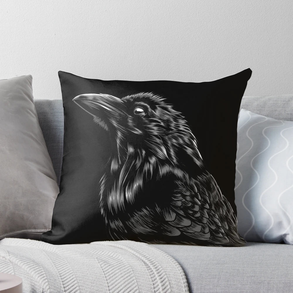 A black and white raven pillow with intricate feather details, perfect for gothic and spiritual decor.
