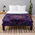 Merkabah star tetrahedron in flower of life design on a purple and blue watercolor plush blanket