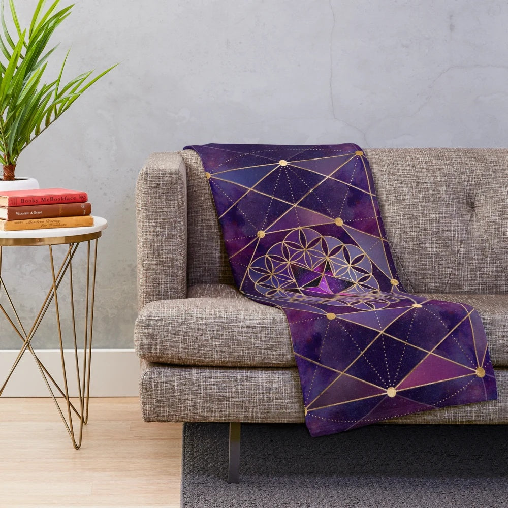Merkabah star tetrahedron in flower of life design on a purple and blue watercolor plush blanket