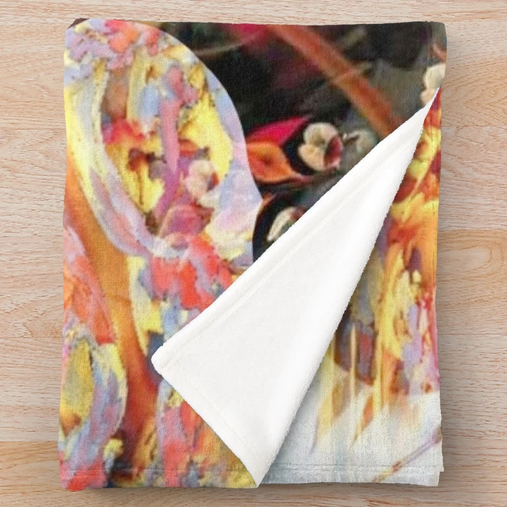 Magical shaman-inspired plush blanket with colorful abstract patterns