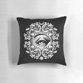 A decorative pillow featuring a detailed third eye design, perfect for adding a touch of mysticism to your home.