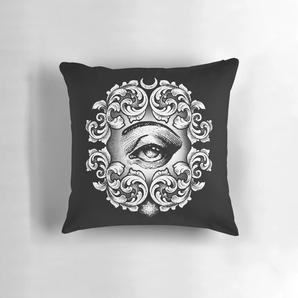 A decorative pillow featuring a detailed third eye design, perfect for adding a touch of mysticism to your home.