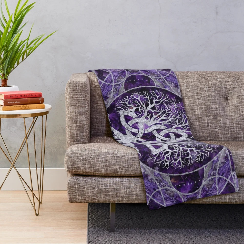 Plush blanket featuring a tree of life design with a triquetra and amethyst and silver accents