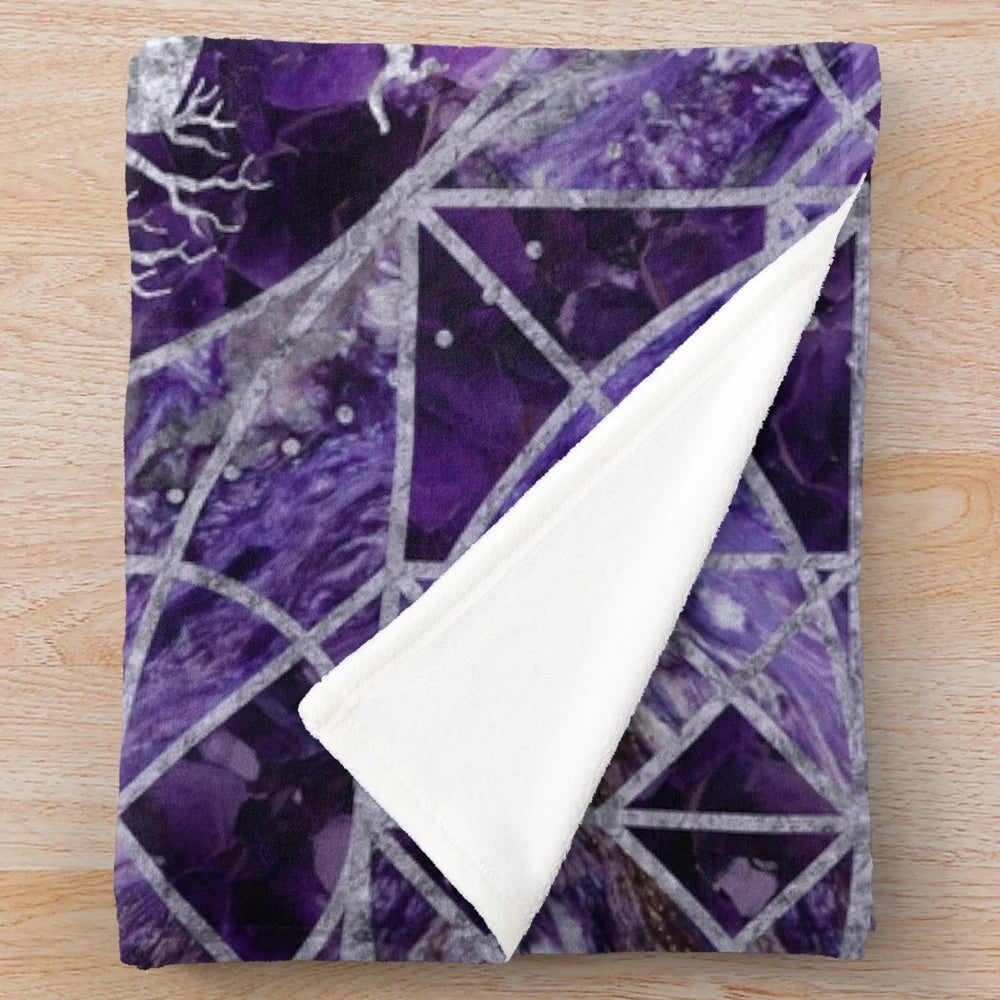 Plush blanket featuring a tree of life design with a triquetra and amethyst and silver accents