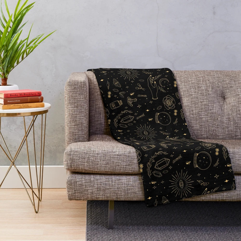 Plush black blanket with hand-drawn witch, moon, crystal, and moth design