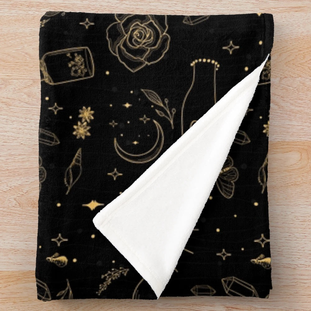 Plush black blanket with hand-drawn witch, moon, crystal, and moth design