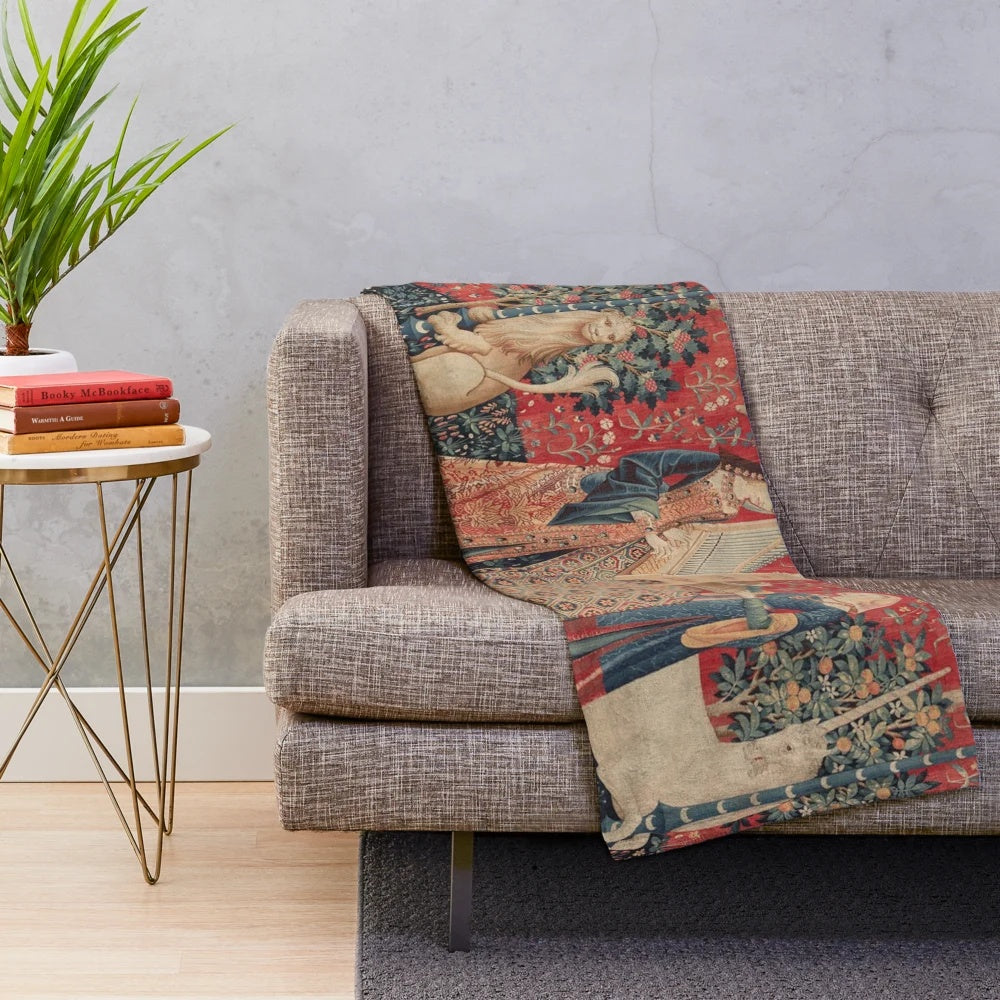Plush blanket featuring a mythical unicorn in a medieval-style floral tapestry design