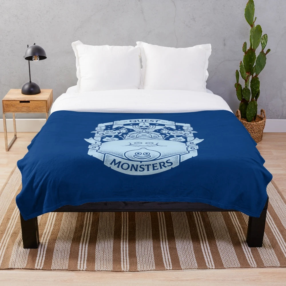 Plush blanket featuring dragons and other quest monsters from classic video games