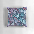 A decorative throw pillow featuring a watercolor-style illustration of a fire-breathing dragon in shades of turquoise and purple.