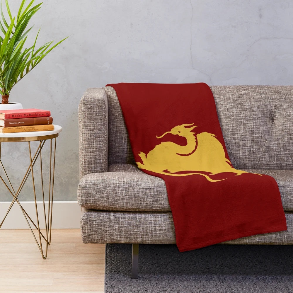 A plush, cozy blanket with a dragon design inspired by the BBC TV series Merlin